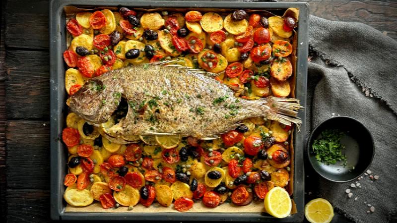 Grilled fagri with cherry tomatoes and olives